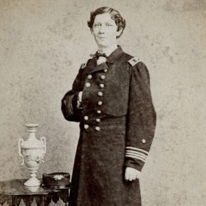 White man in military garb posing with hand inside suit jacket