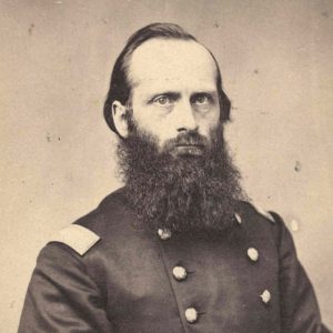 White man in military garb with bushy beard