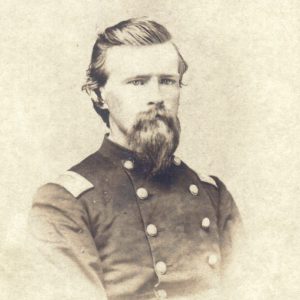 White man in military garb with beard and mustache