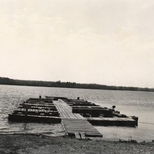 Wooden dock with boat slips on a lake