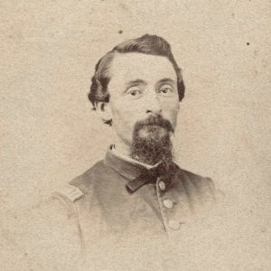 White man in military garb with beard and mustache