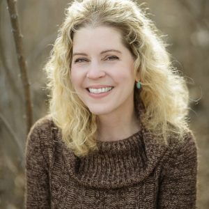 Portrait of smiling white woman with blond hair