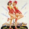 Poster featuring two white women posing in red and yellow costumes