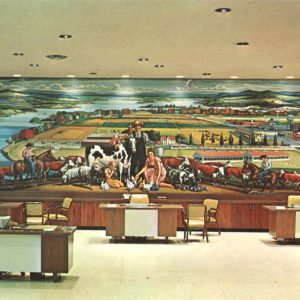 Large mural countryside and a waterway painted on a bank interior wall