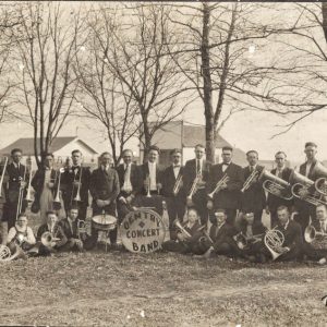 Group of white male musicians with marching band instruments