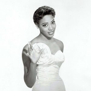 African American woman wearing strapless white evening gown