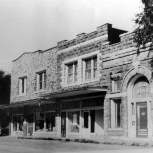 Multistory stone buildings in a small town street scene