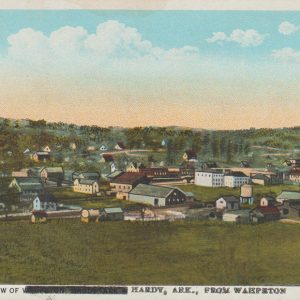 A postcard featuring a town in a valley