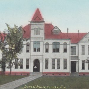 Multistory white school building with a red roof