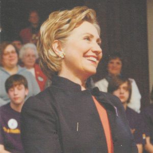 A pamphlet cover featuring a white woman standing in front of a group of children