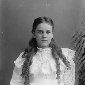 long-haired white girl about nine years old in white dress