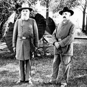 Two white men in military uniforms with swords