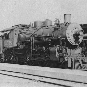 Locomotive traveling on railroad tracks