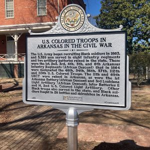 Metal display with Arkansas state seal and Division of Arkansas Heritage logo text explains quantity and regiments of Black Union Troops in Arkansas