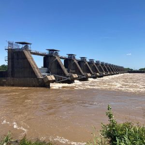 Side view of dam structure and river