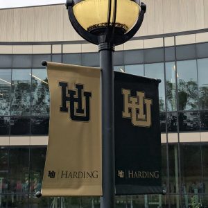 View of banners with university logo and text "Harding" on both sides of light post