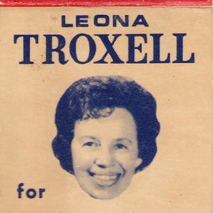 Paperboard folder laid flat with face of white woman short hair smiling on one side text "Leona Troxell for State Treasurer" on both sides text "Go Republican" in middle
